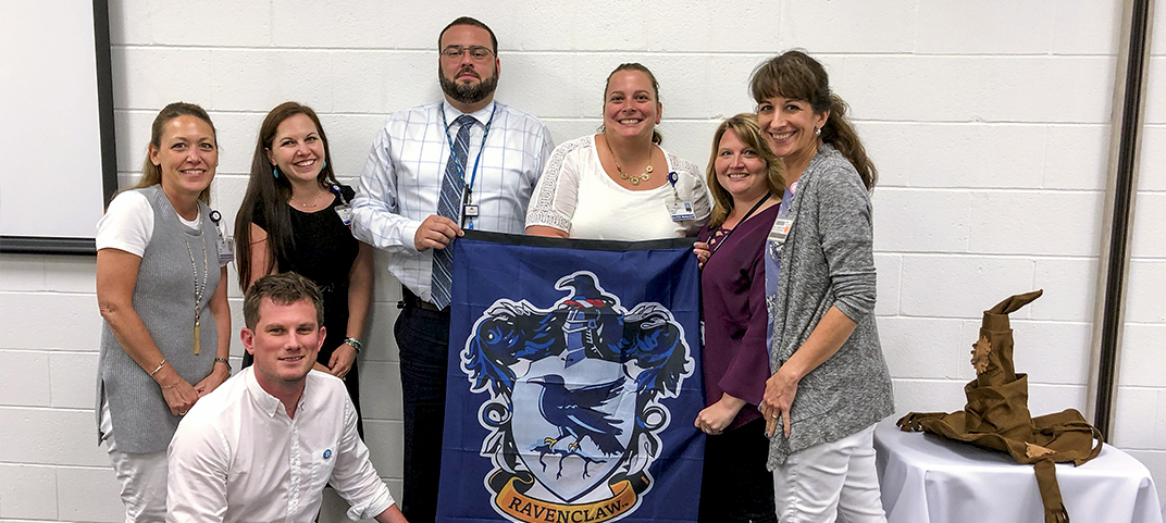 Winning team with their Harry Potter house flag