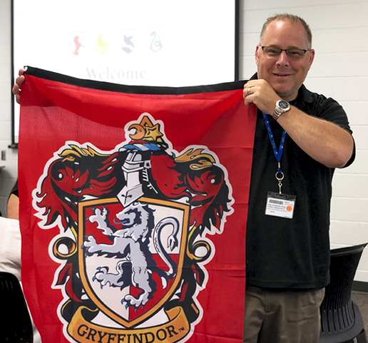 Guy holding Gryffindor flag