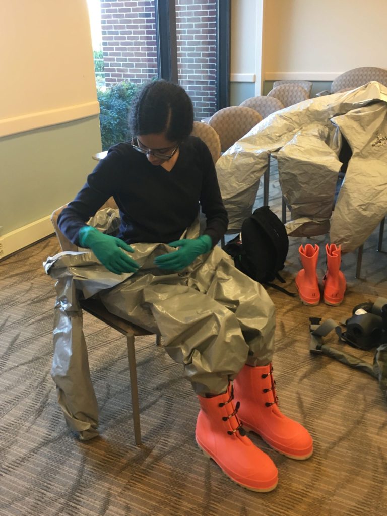 Adithi in a hazmat suit
